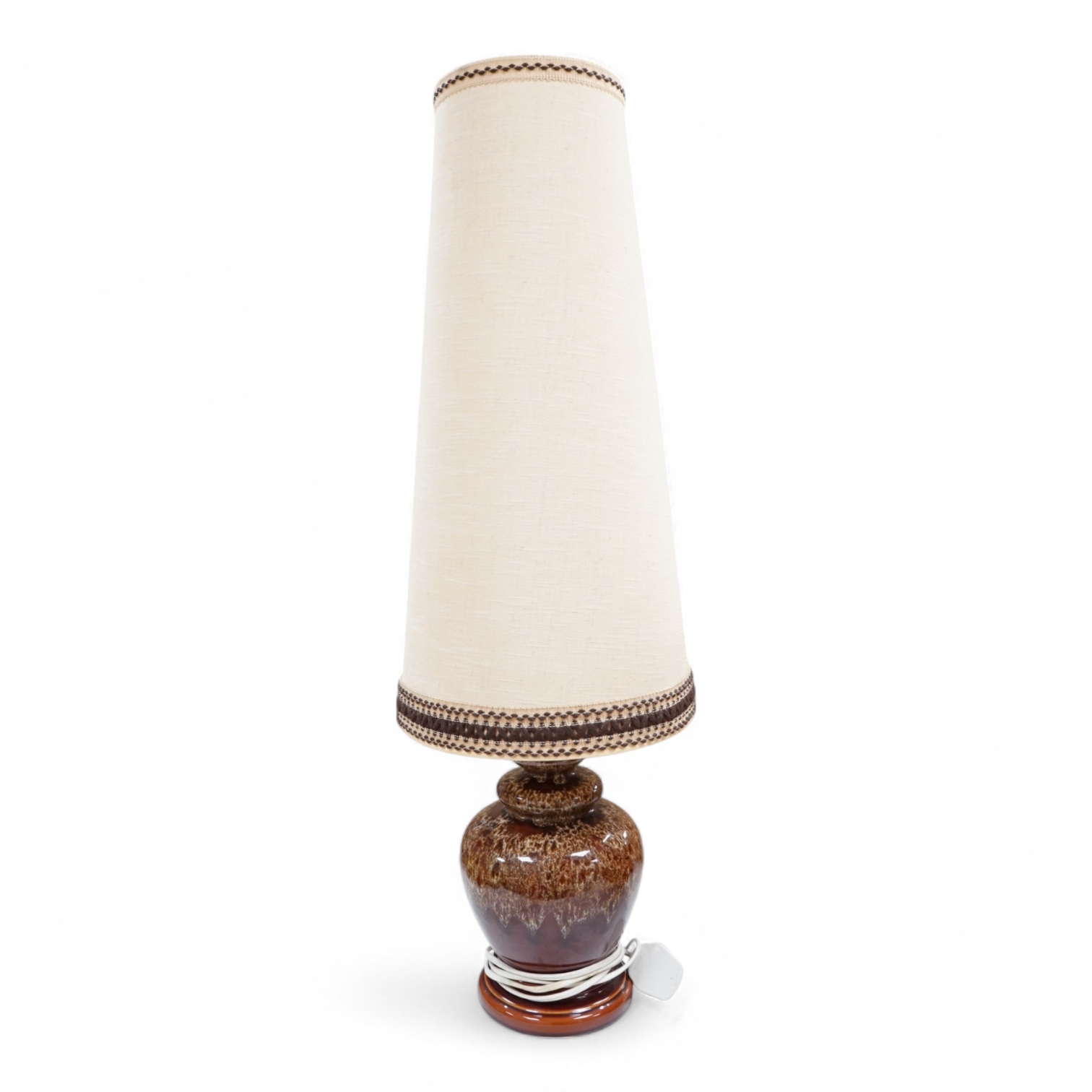 A mid century modern brown glazed ceramic table lamp and brown braided shade, 84cm including shade